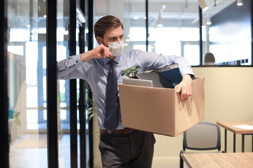 dismissal employee preventive medical mask epidemic coronavirus dismissed worker going from office with his office supplies min